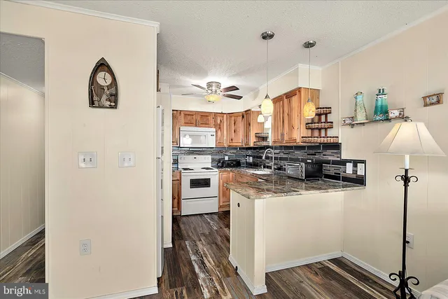 a kitchen with stainless steel appliances a stove sink and cabinets