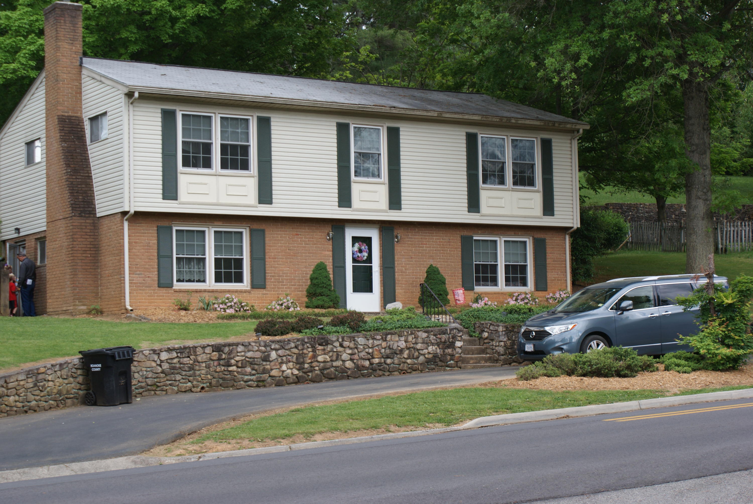 3630 Grandin Road Roanoke, VA 24018 - Photo 2 of 21 a front view of a house with a yard