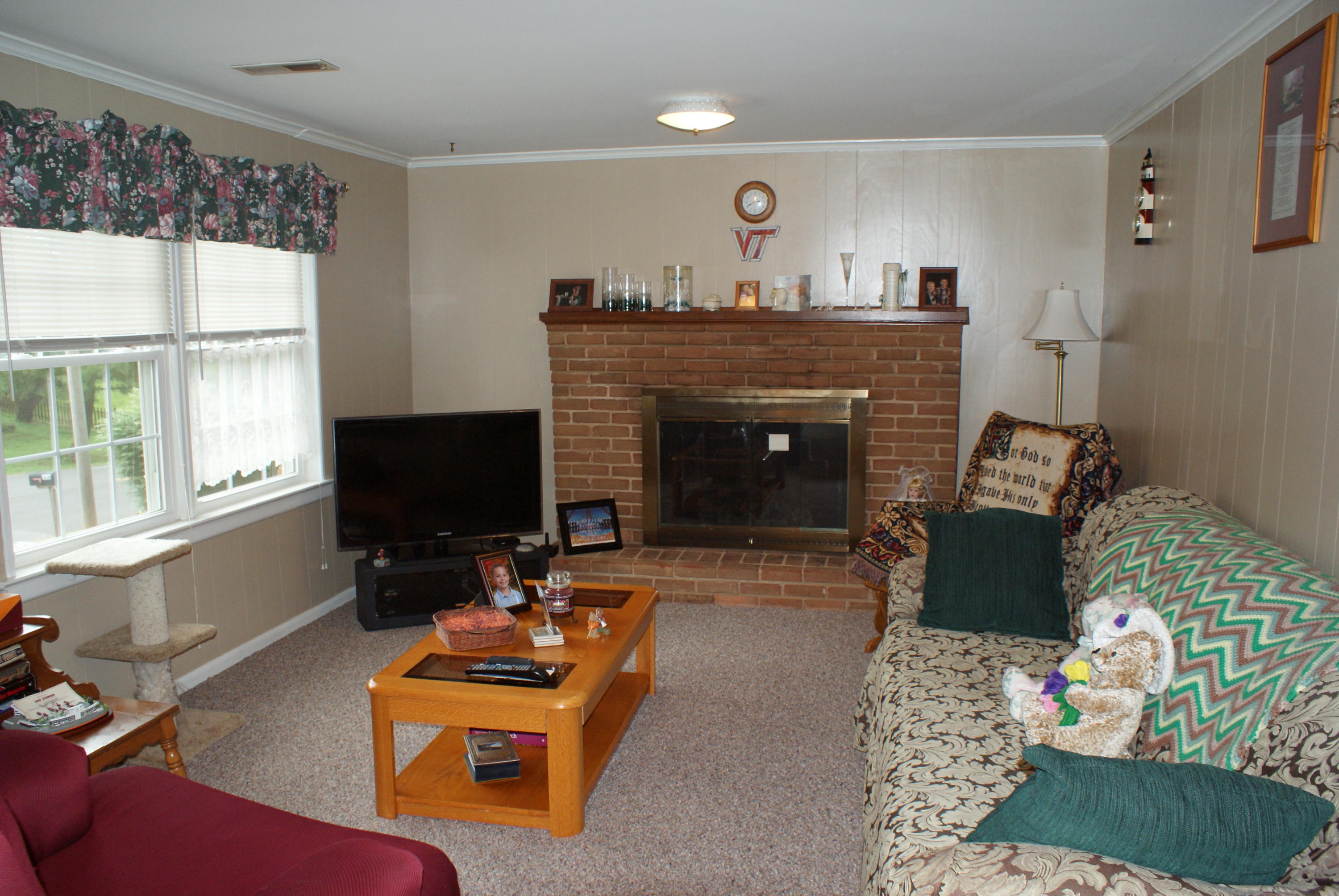 3630 Grandin Road Roanoke, VA 24018 - Photo 6 of 21 a living room with furniture and a fireplace