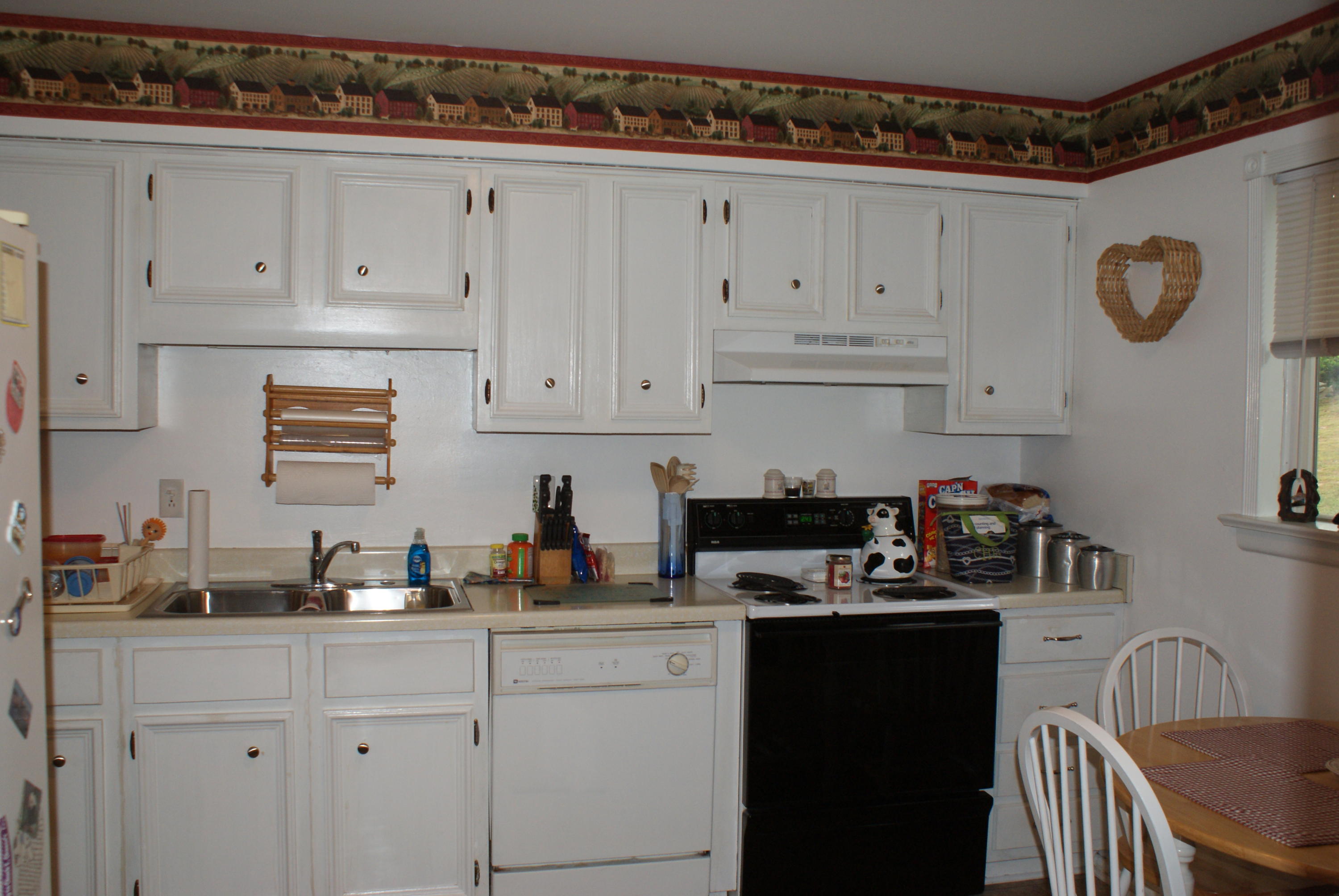 3630 Grandin Road Roanoke, VA 24018 - Photo 9 of 21 a kitchen with cabinets appliances and a sink