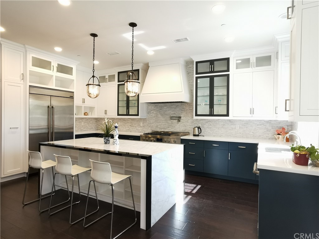 a kitchen with a sink cabinets and window