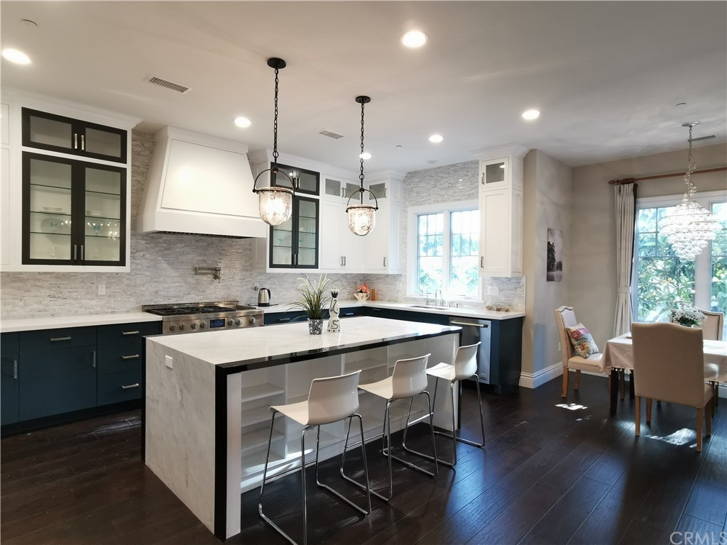 501 Cortez Road Arcadia, CA 91007 - Photo 2 of 15 a kitchen with sink cabinets and wooden floor