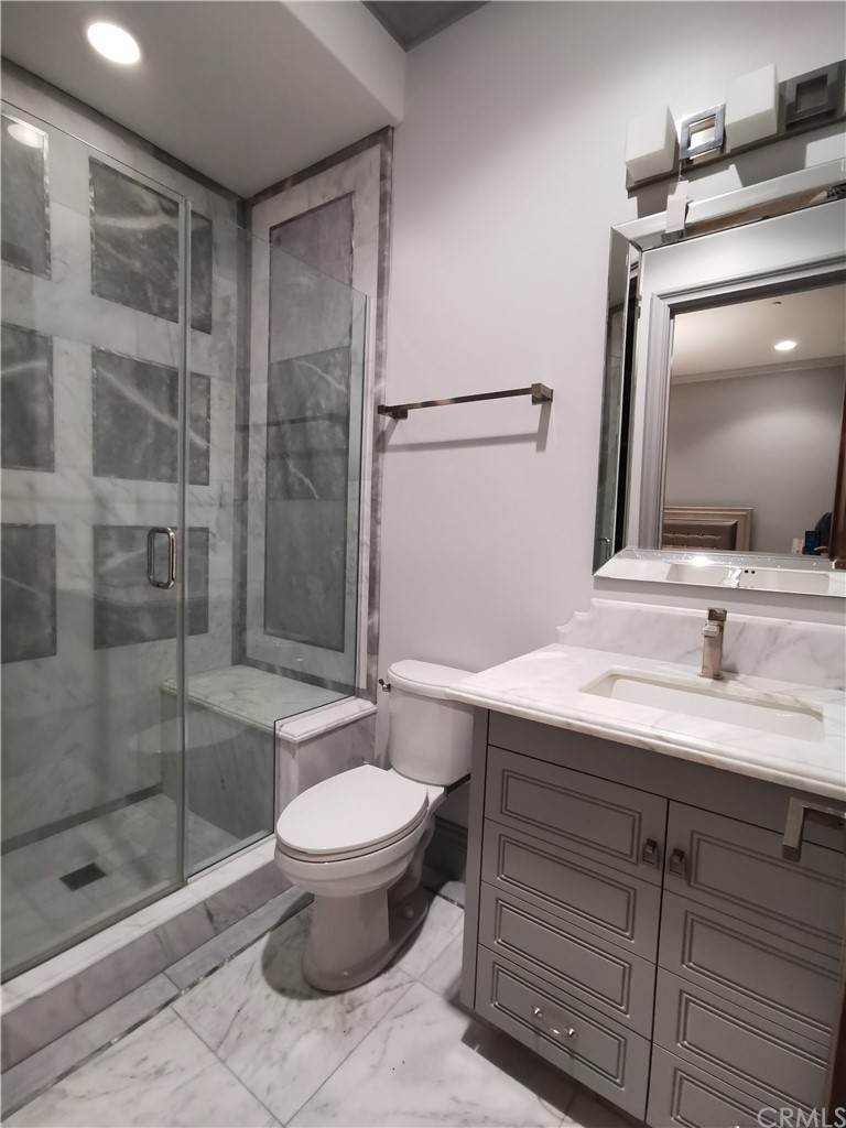 501 Cortez Road Arcadia, CA 91007 - Photo 13 of 15 a bathroom with a sink a toilet and shower