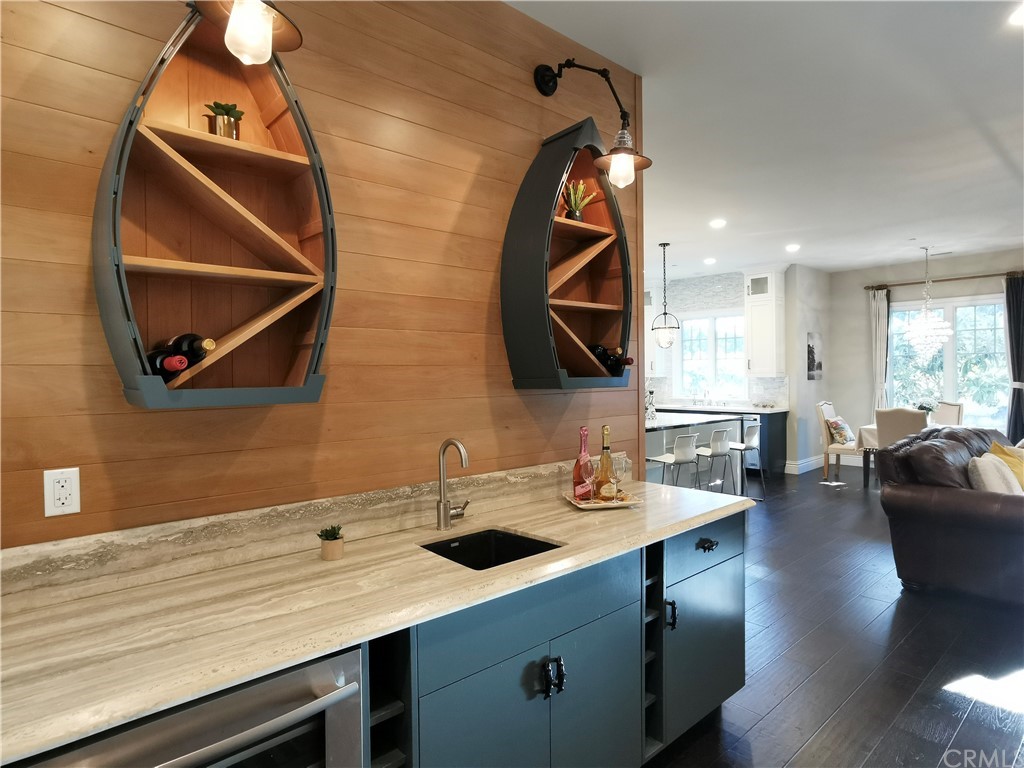 501 Cortez Road Arcadia, CA 91007 - Photo 4 of 15 a kitchen with a sink cabinets and a wooden floor