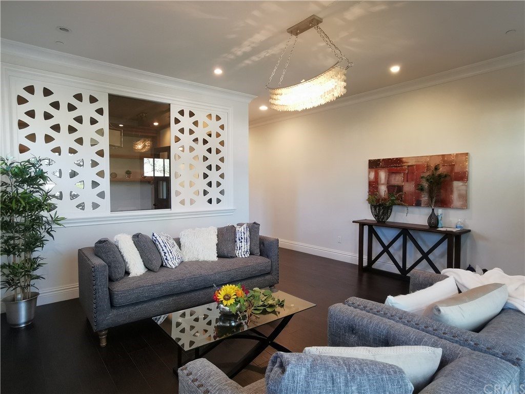 501 Cortez Road Arcadia, CA 91007 - Photo 6 of 15 a living room with furniture and wooden floor
