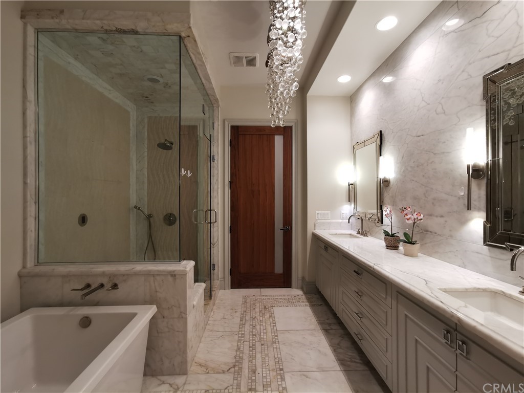 501 Cortez Road Arcadia, CA 91007 - Photo 10 of 15 a bathroom with a tub sink shower and mirror