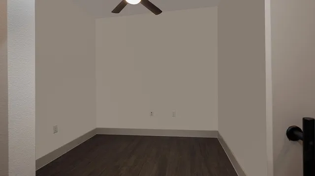 a view of a small space with wooden floor