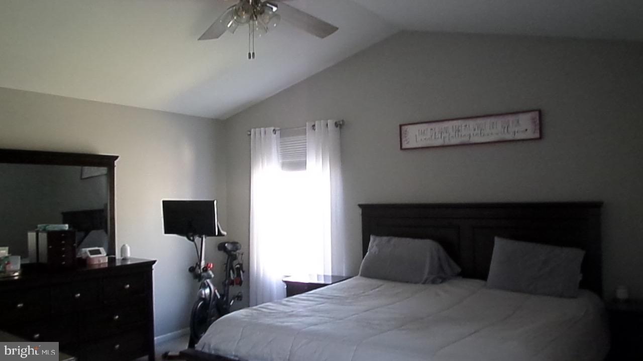 129 Country Lane Sicklerville, NJ 08081 - Photo 11 of 53 a bedroom with a bed and a flat tv screen on the dresser