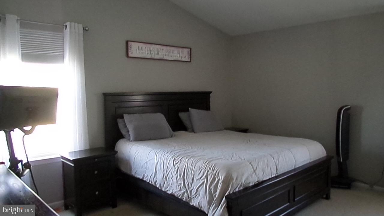 129 Country Lane Sicklerville, NJ 08081 - Photo 12 of 53 a bedroom with a bed and a flat screen tv