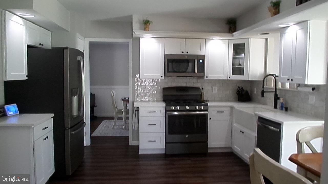 129 Country Lane Sicklerville, NJ 08081 - Photo 22 of 53 a kitchen with stainless steel appliances a refrigerator stove and sink