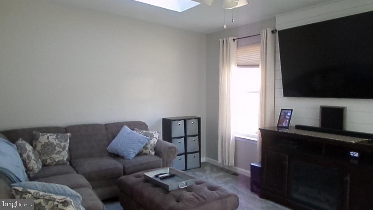 129 Country Lane Sicklerville, NJ 08081 - Photo 24 of 53 a living room with furniture and a flat screen tv
