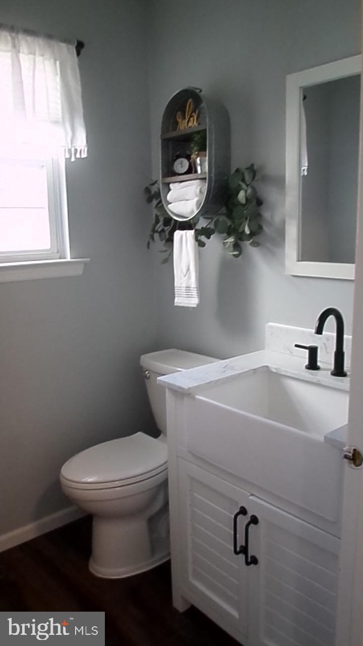 129 Country Lane Sicklerville, NJ 08081 - Photo 34 of 53 a bathroom with a toilet and a sink