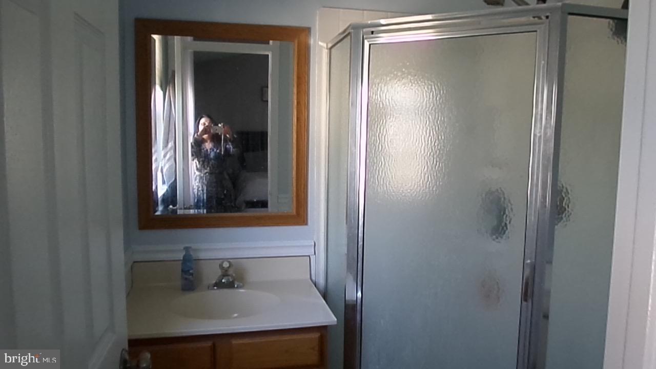 129 Country Lane Sicklerville, NJ 08081 - Photo 36 of 53 a bathroom with a sink and mirror with toilet