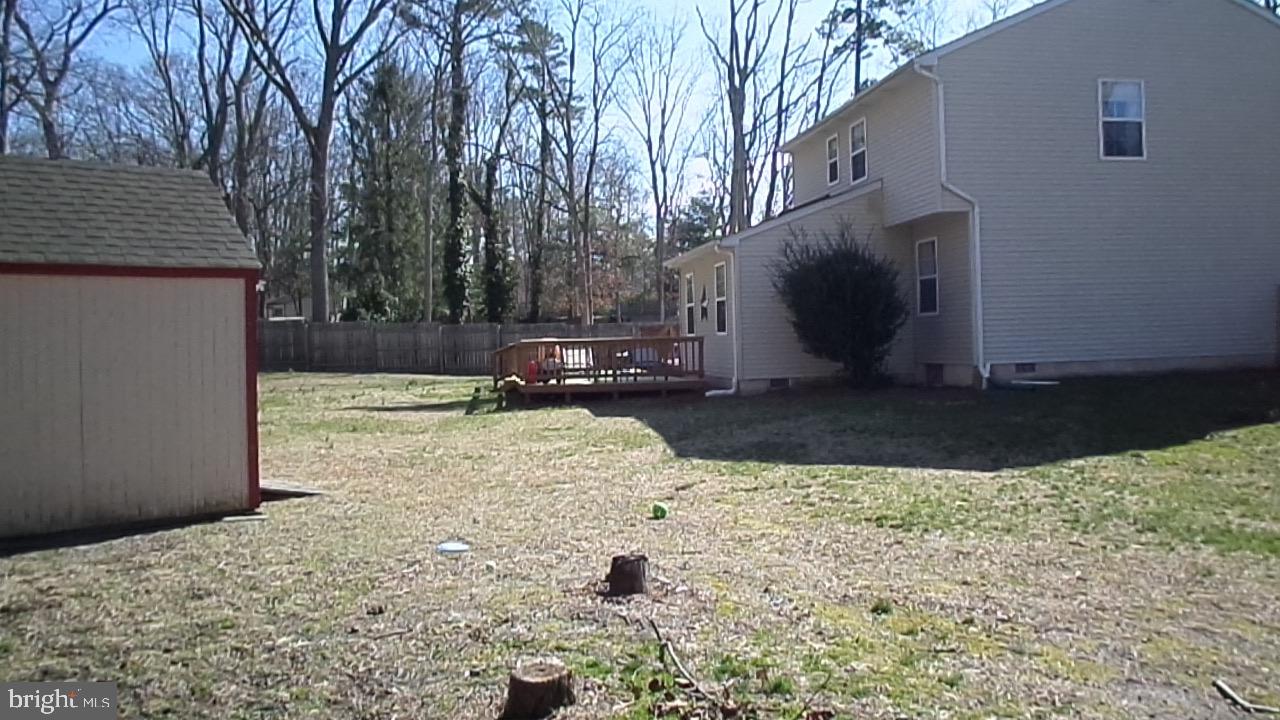 129 Country Lane Sicklerville, NJ 08081 - Photo 49 of 53 a view of a backyard with a tree