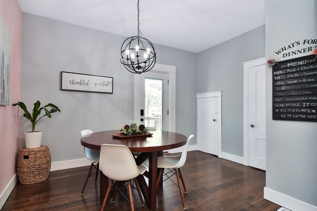 15 Balcomb Street Salem, MA 01970 - Photo 11 of 42 a view of a dining room with furniture wooden floor and chandelier