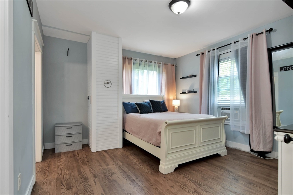 15 Balcomb Street Salem, MA 01970 - Photo 13 of 42 a bedroom with a bed and a night stand