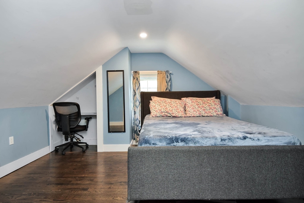 15 Balcomb Street Salem, MA 01970 - Photo 21 of 42 a bedroom with a bed and wooden floor