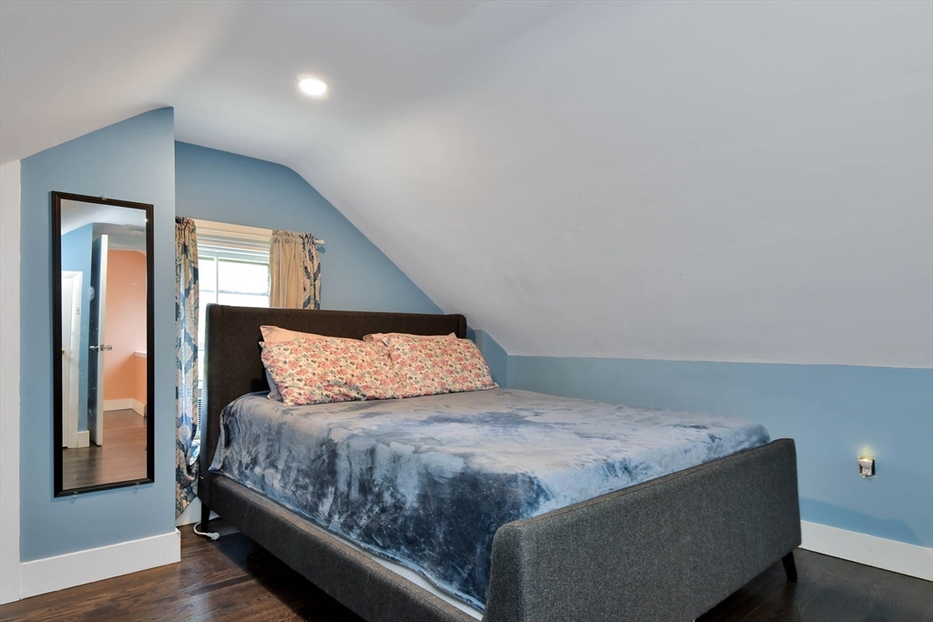 15 Balcomb Street Salem, MA 01970 - Photo 22 of 42 a bedroom with a bed and a mirror