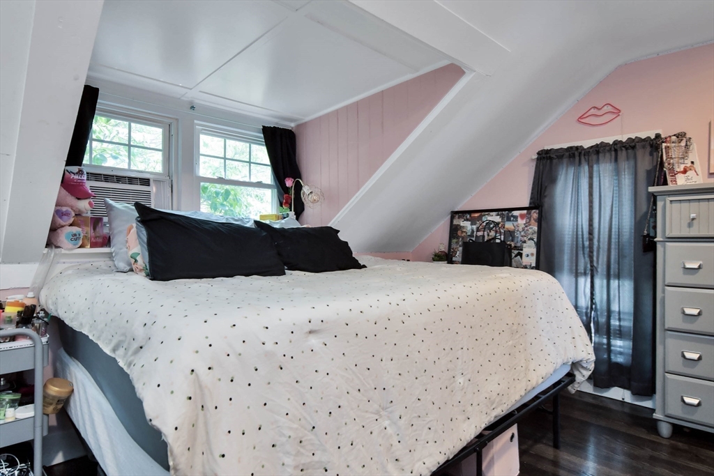 15 Balcomb Street Salem, MA 01970 - Photo 26 of 42 a bedroom with a bed and wooden floor