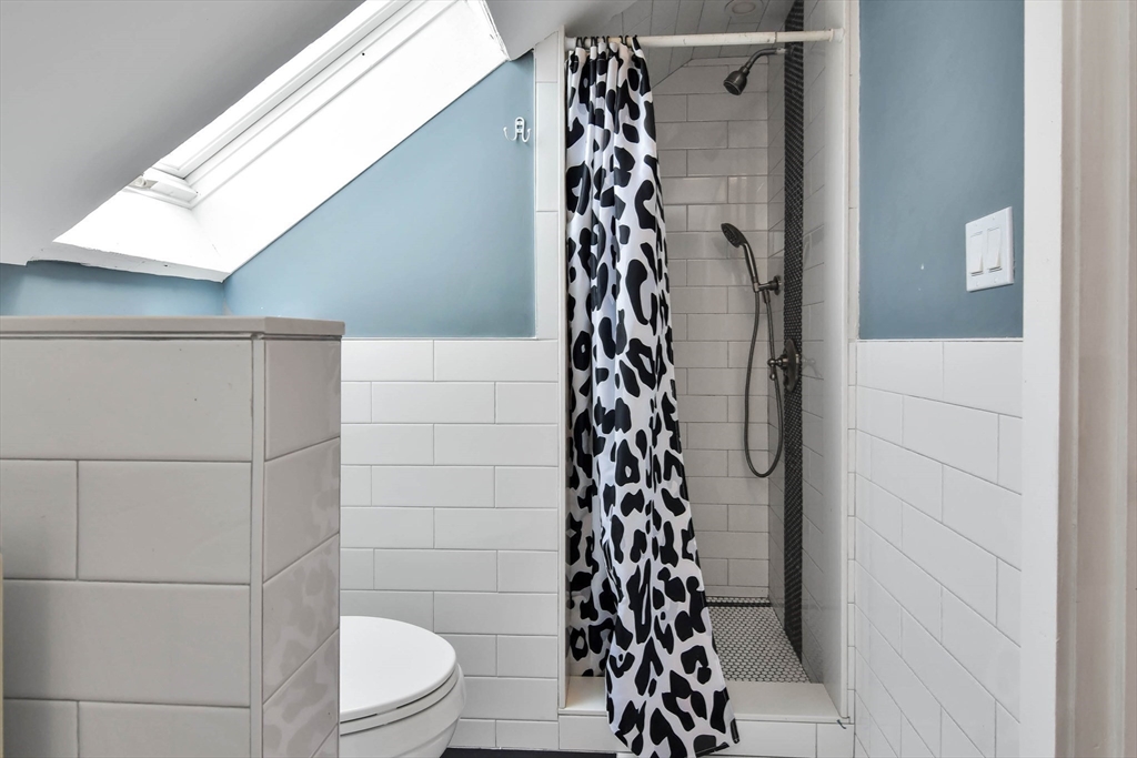 15 Balcomb Street Salem, MA 01970 - Photo 31 of 42 a bathroom with a shower and a toilet