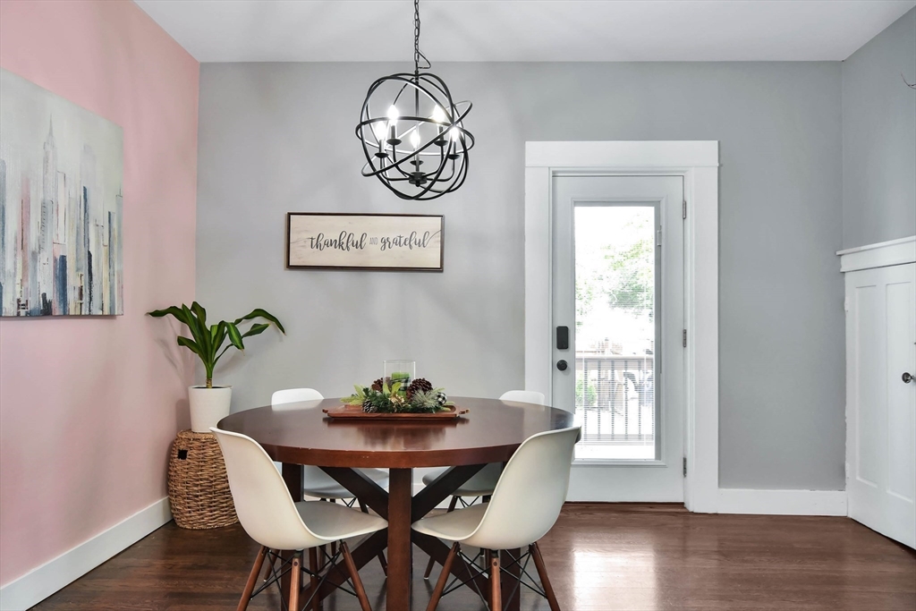 15 Balcomb Street Salem, MA 01970 - Photo 10 of 42 a view of a dining room with furniture wooden floor and a chandelier