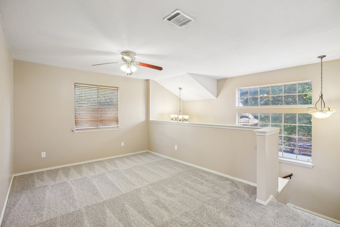 1132 Pine Portage Loop Leander, TX 78641 - Photo 17 of 39 a view of an empty room with a window