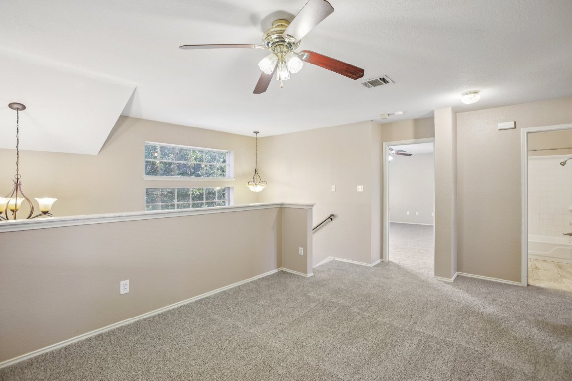 1132 Pine Portage Loop Leander, TX 78641 - Photo 18 of 39 a view of an empty room with window