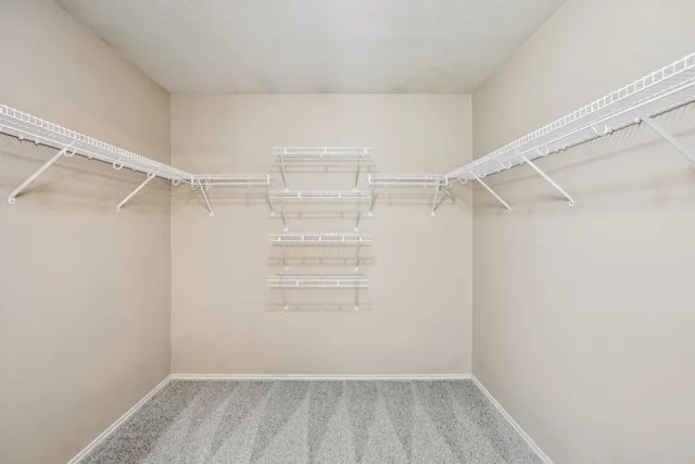 an empty room with closet area