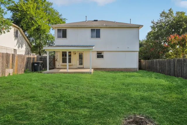 swimming pool view with a seating space and a garden