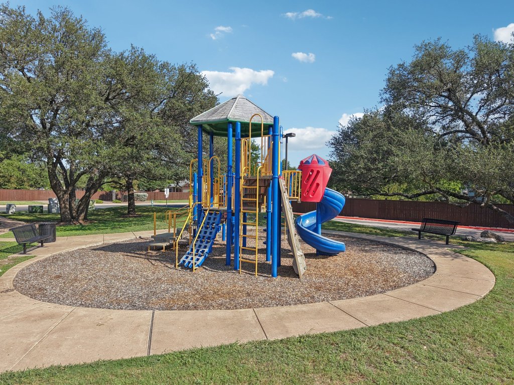 1132 Pine Portage Loop Leander, TX 78641 - Photo 35 of 39 a view of a park with slide