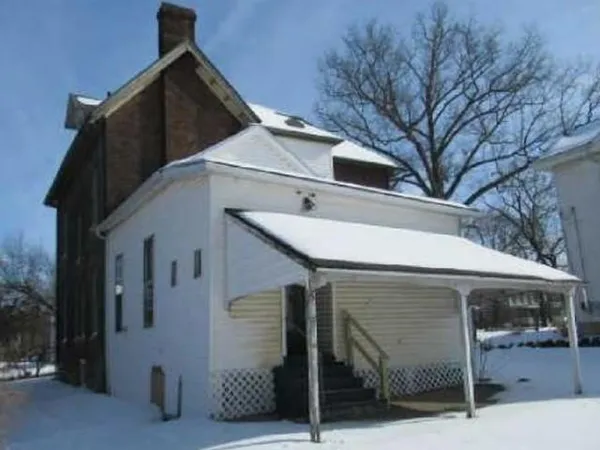 a front view of a house with garage