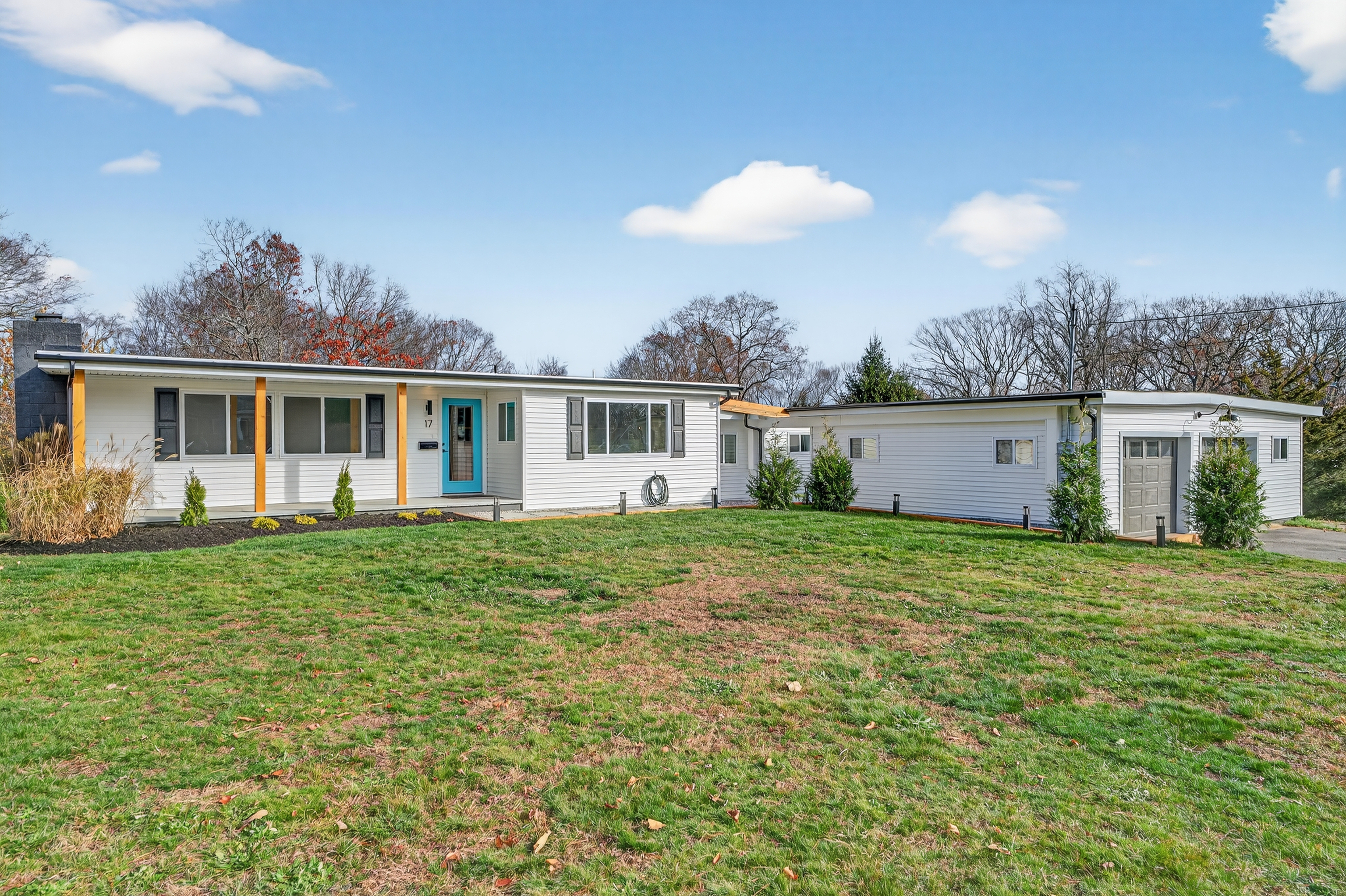 a view of a house with a backyard and a garden