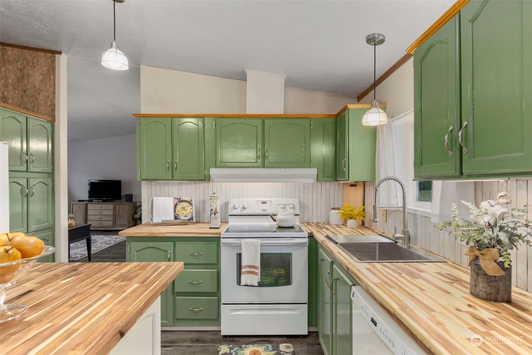 8638 173rd Avenue Southwest Rochester, WA 98579 - Photo 12 of 40 a kitchen with a sink stove and cabinets