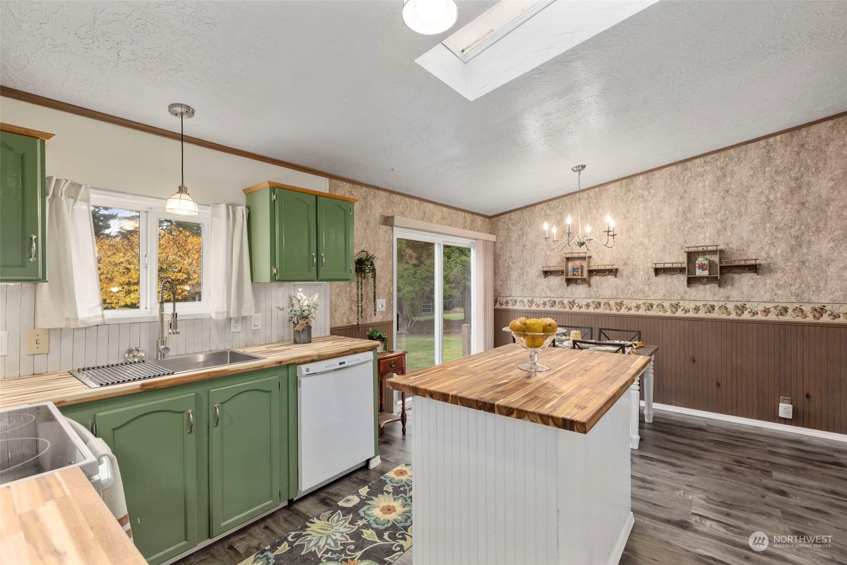 8638 173rd Avenue Southwest Rochester, WA 98579 - Photo 15 of 40 a kitchen with sink cabinets and wooden floor