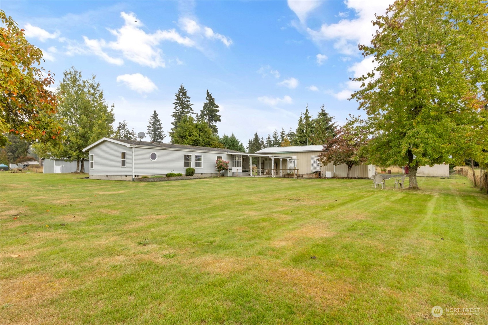 8638 173rd Avenue Southwest Rochester, WA 98579 - Photo 2 of 40 a house view with swimming pool in front of it