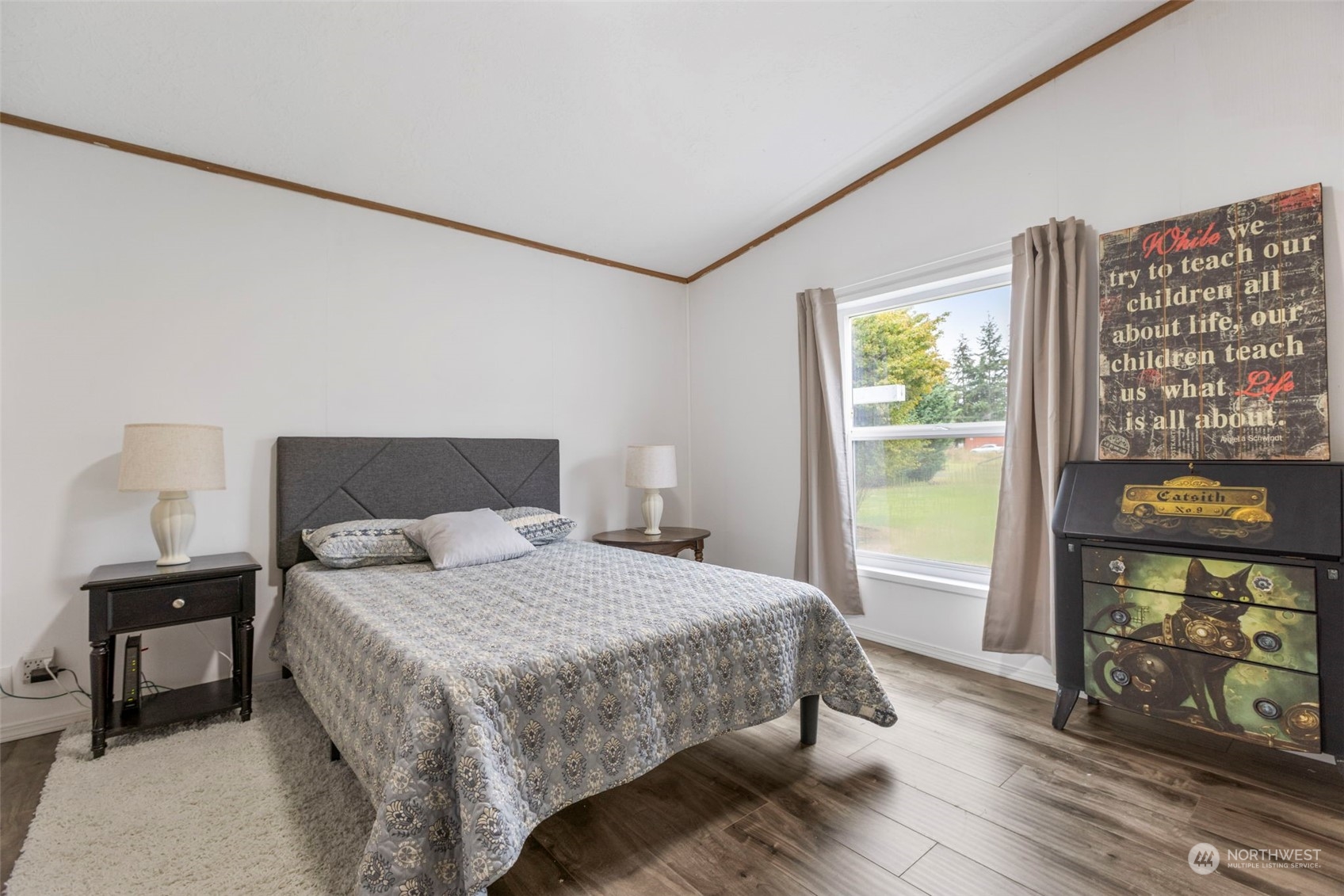 8638 173rd Avenue Southwest Rochester, WA 98579 - Photo 23 of 40 a bedroom with a bed and a dresser next to a window