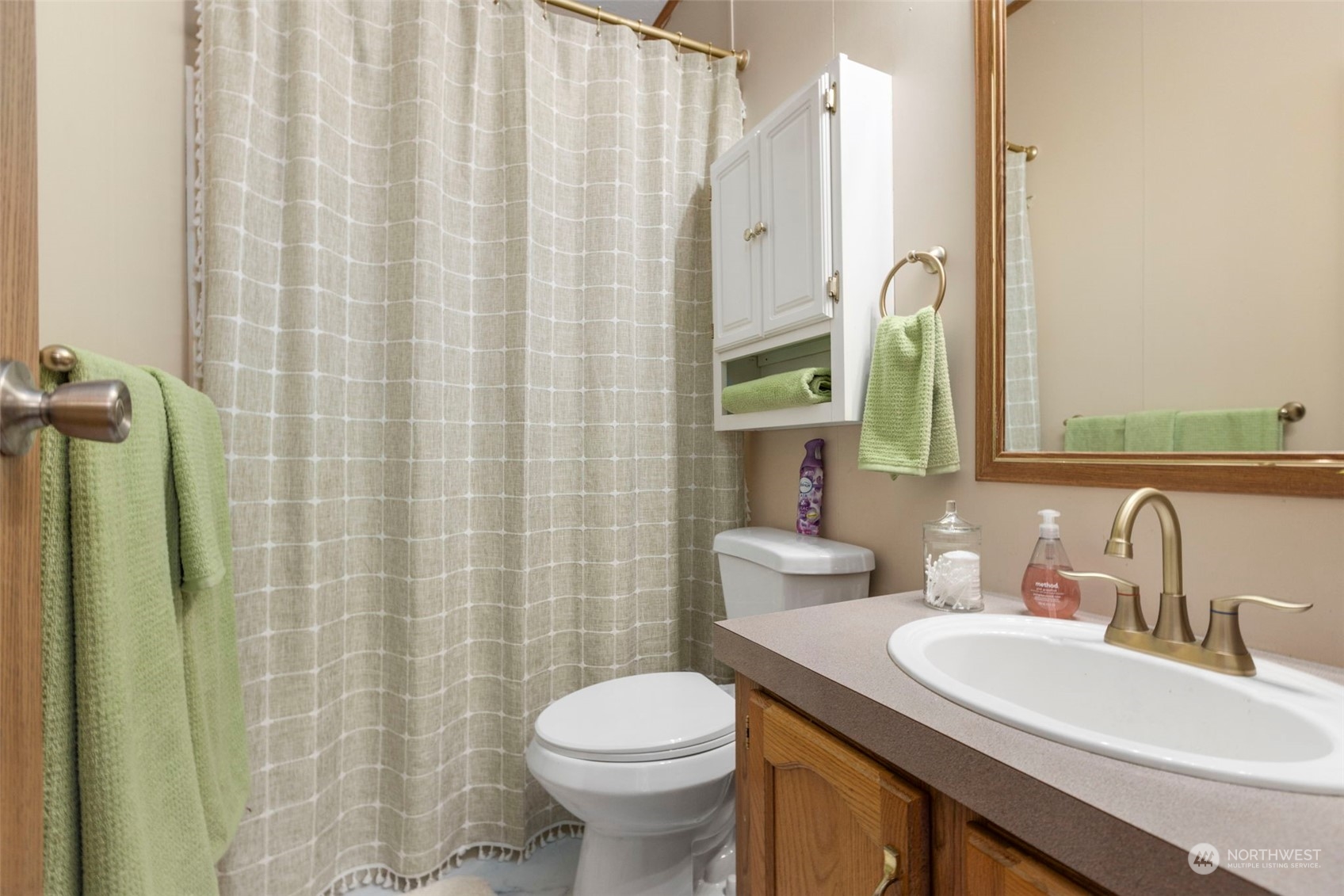 8638 173rd Avenue Southwest Rochester, WA 98579 - Photo 25 of 40 a bathroom with a sink a toilet and shower