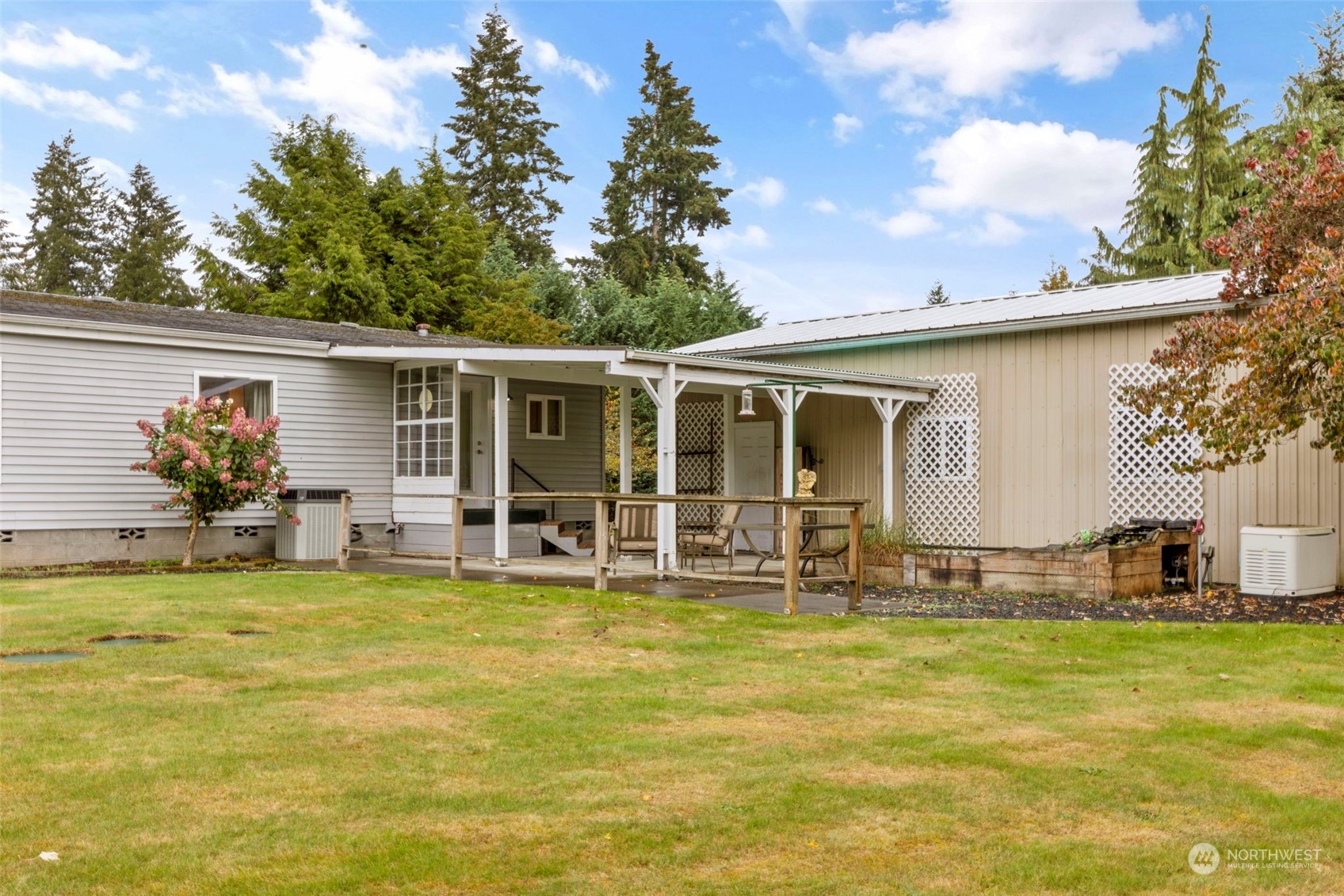 8638 173rd Avenue Southwest Rochester, WA 98579 - Photo 31 of 40 a swimming pool with outdoor seating and yard
