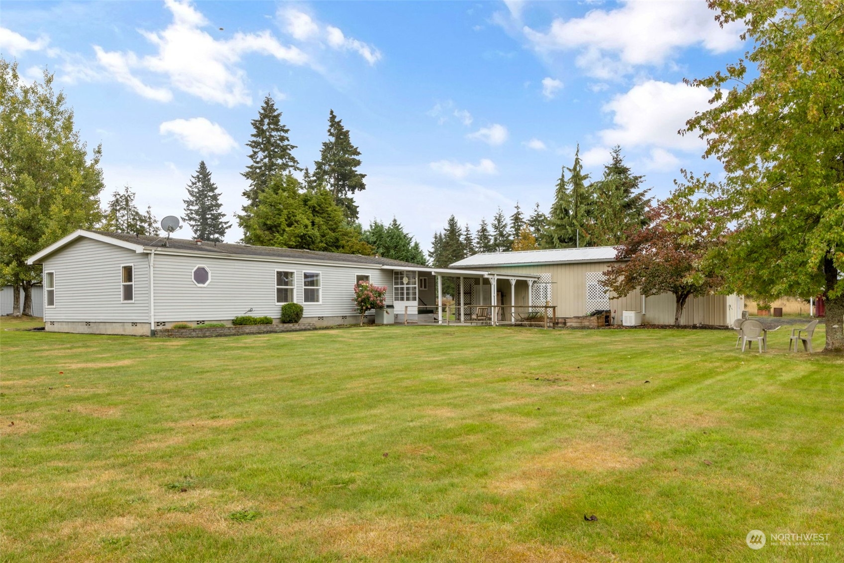8638 173rd Avenue Southwest Rochester, WA 98579 - Photo 32 of 40 a front view of a house with a garden