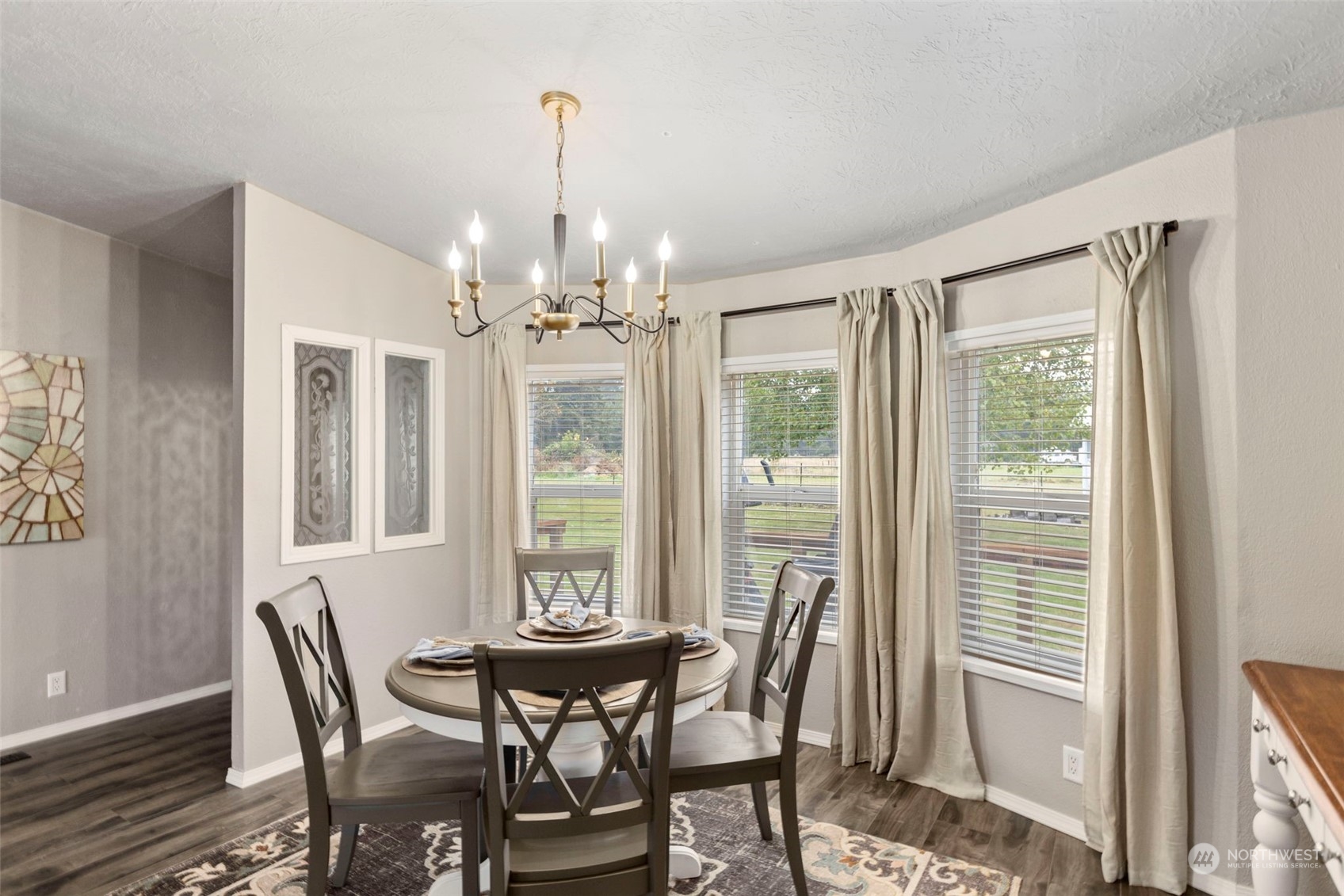 8638 173rd Avenue Southwest Rochester, WA 98579 - Photo 4 of 40 a view of a dining room with furniture wooden floor and chandelier