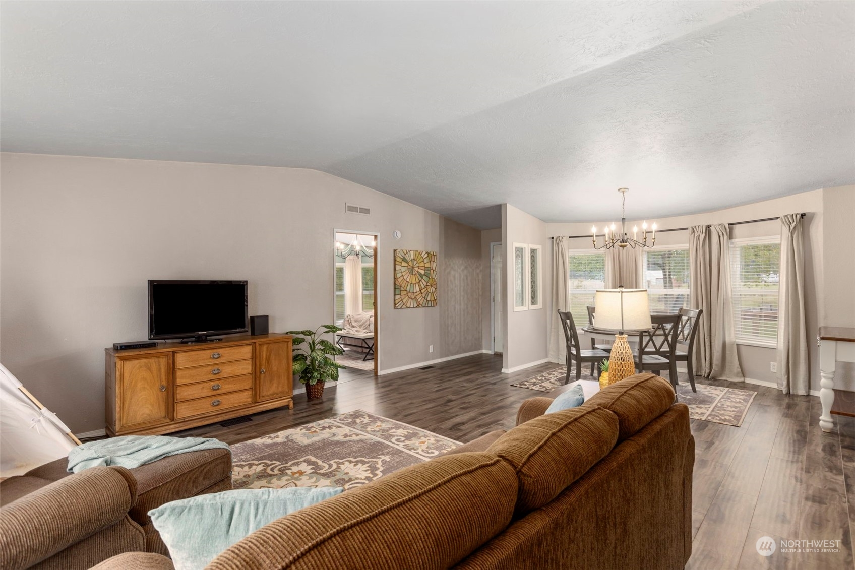 8638 173rd Avenue Southwest Rochester, WA 98579 - Photo 7 of 40 a living room with furniture and a flat screen tv