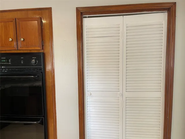 a view of cabinets and wooden floor