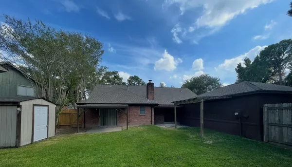 a view of a back yard of the house