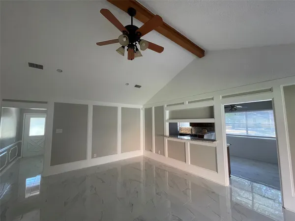 a view of a kitchen with a sink and dishwasher cabinets