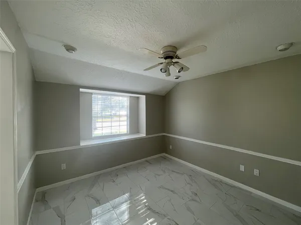 an empty room with a empty space and windows