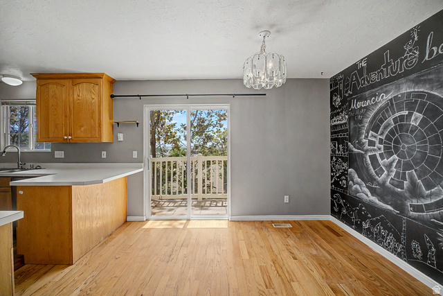2058 California Avenue, Unit 2 Provo, UT 84606 - Photo 19 of 32 Hardwood flooring throughout, with a chalkboard accent wall