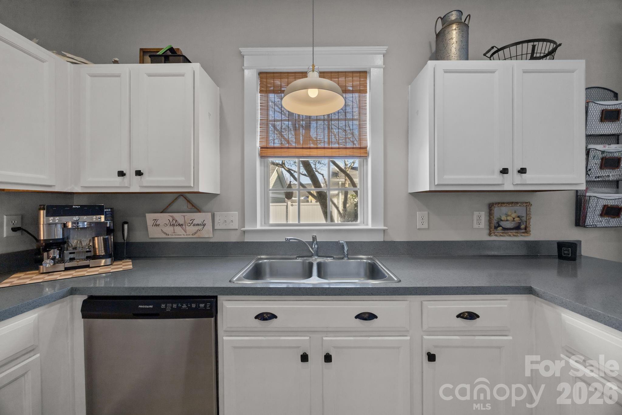 8111 Bud Henderson Road Huntersville, NC 28078 - Photo 12 of 39 a kitchen with granite countertop white cabinets and a stove