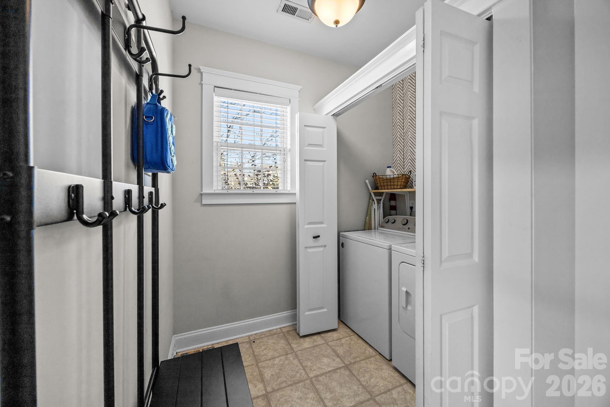 8111 Bud Henderson Road Huntersville, NC 28078 - Photo 18 of 39 a view of hallway with walk in closet and wooden floor