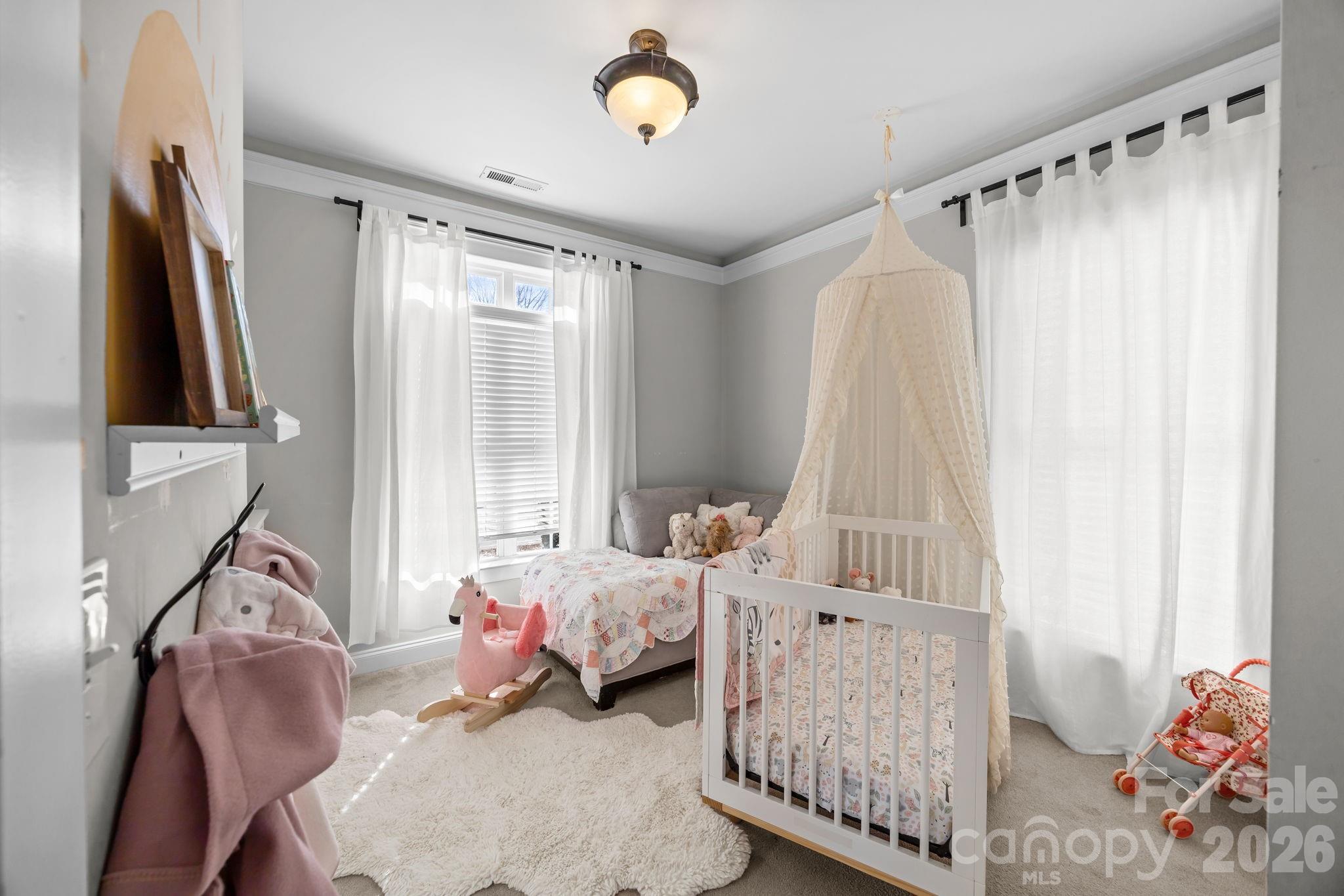 8111 Bud Henderson Road Huntersville, NC 28078 - Photo 20 of 39 a bedroom with a bed and a window