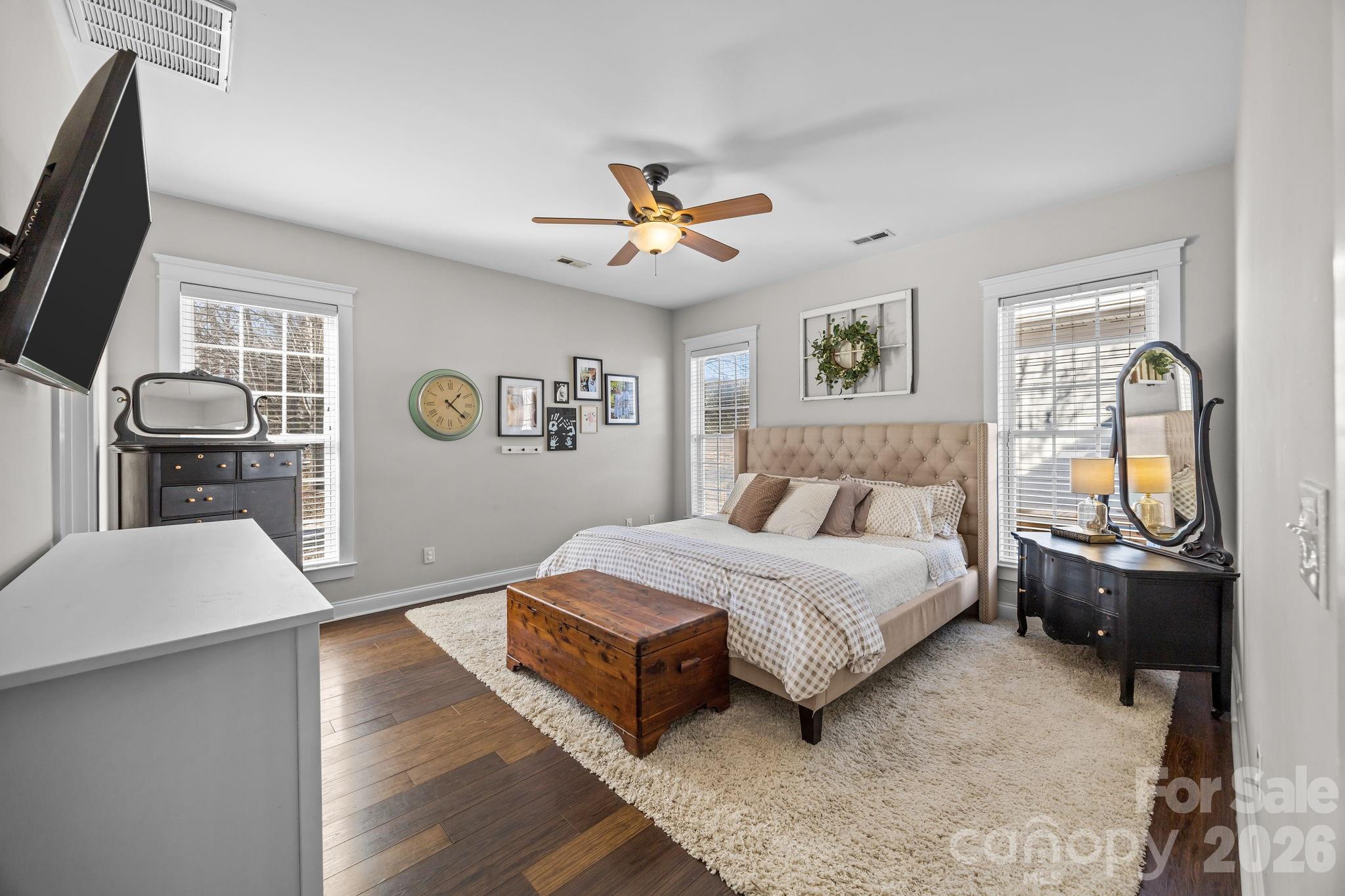 8111 Bud Henderson Road Huntersville, NC 28078 - Photo 23 of 39 a spacious bedroom with a bed dresser and a window